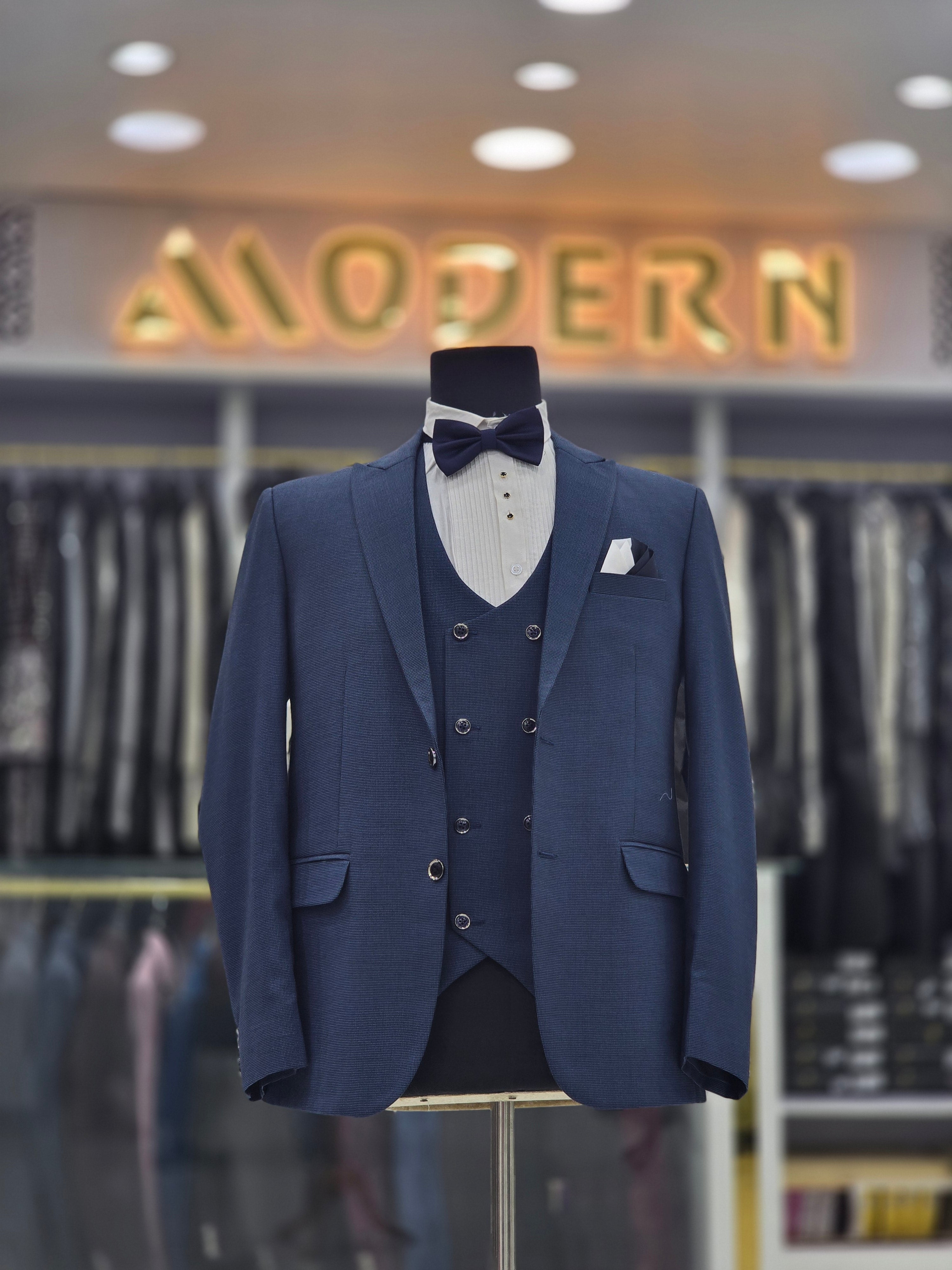 Parish blue colored self design 3pc formal suits with pants blazer and waistcoat.