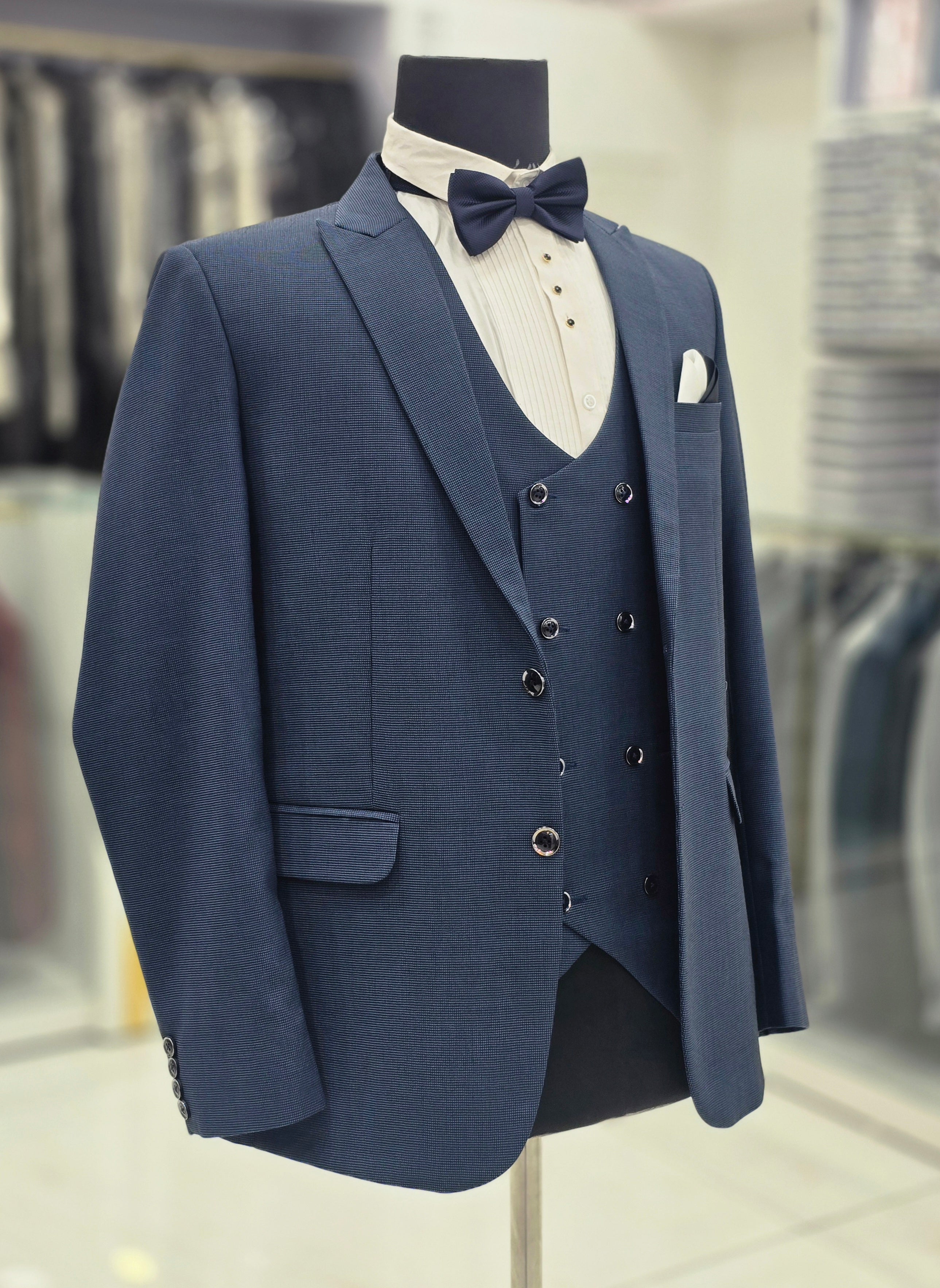 Parish blue colored self design 3pc formal suits with pants blazer and waistcoat.