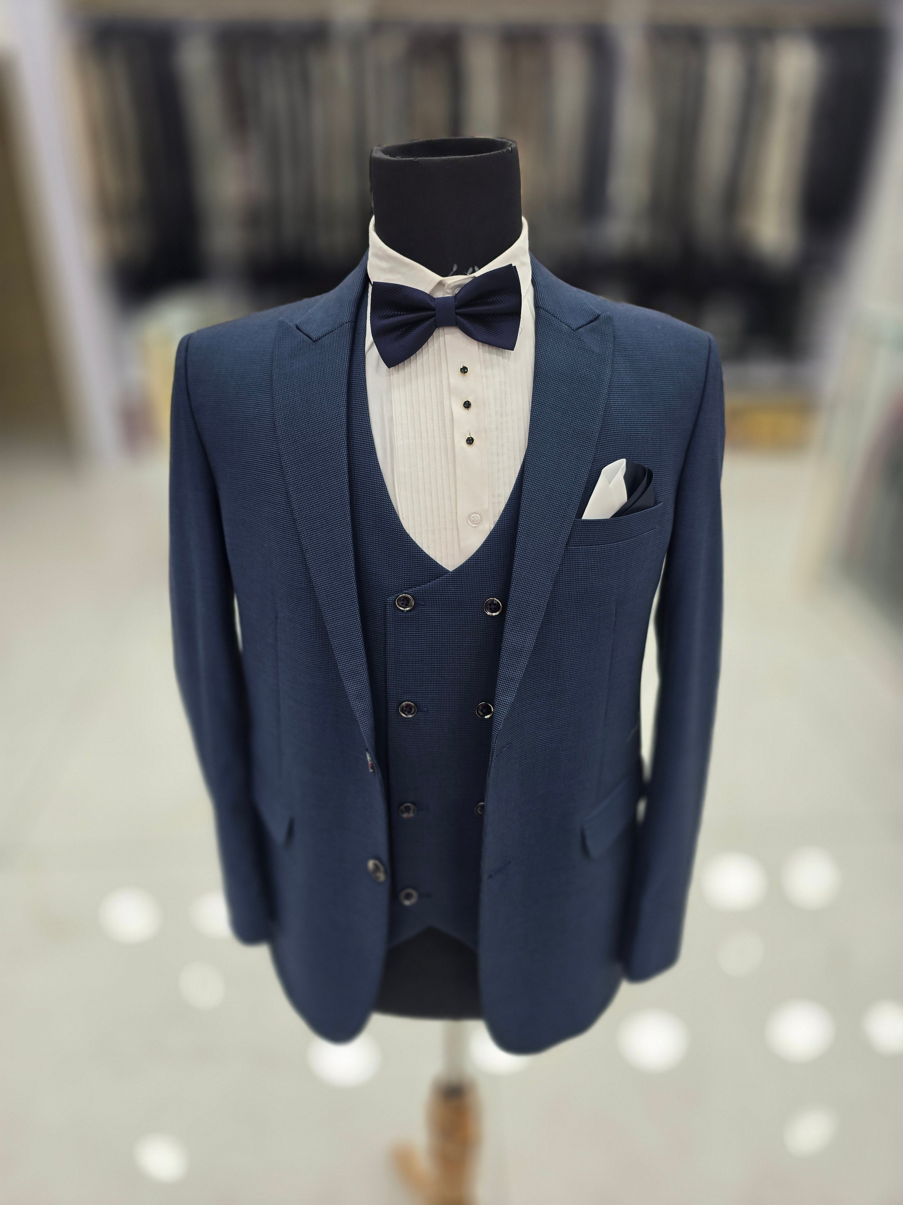 Parish blue colored self design 3pc formal suits with pants blazer and waistcoat.