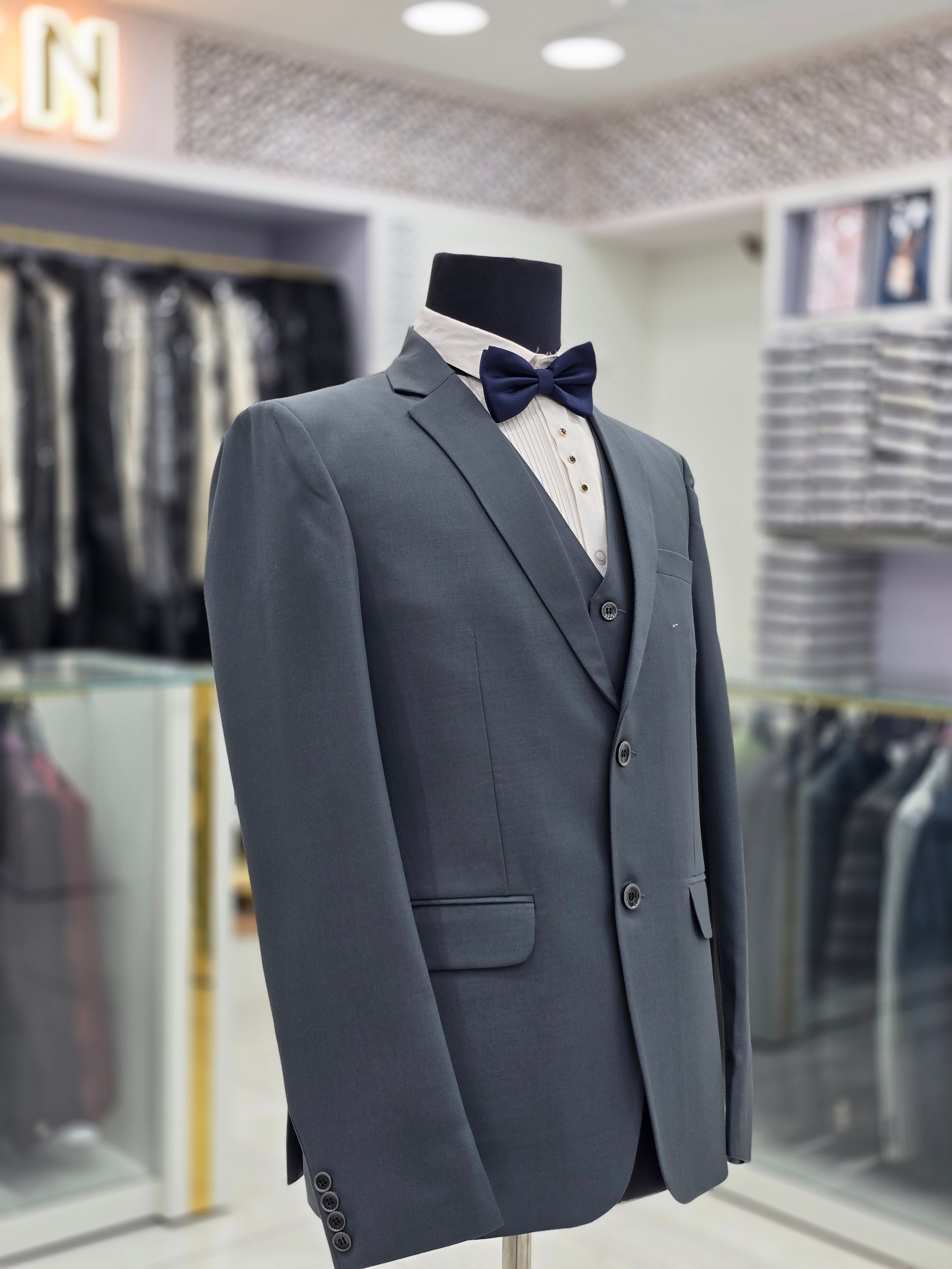 Sage green coloured self design formal suit 3 piece with pants blazer and waistcoat