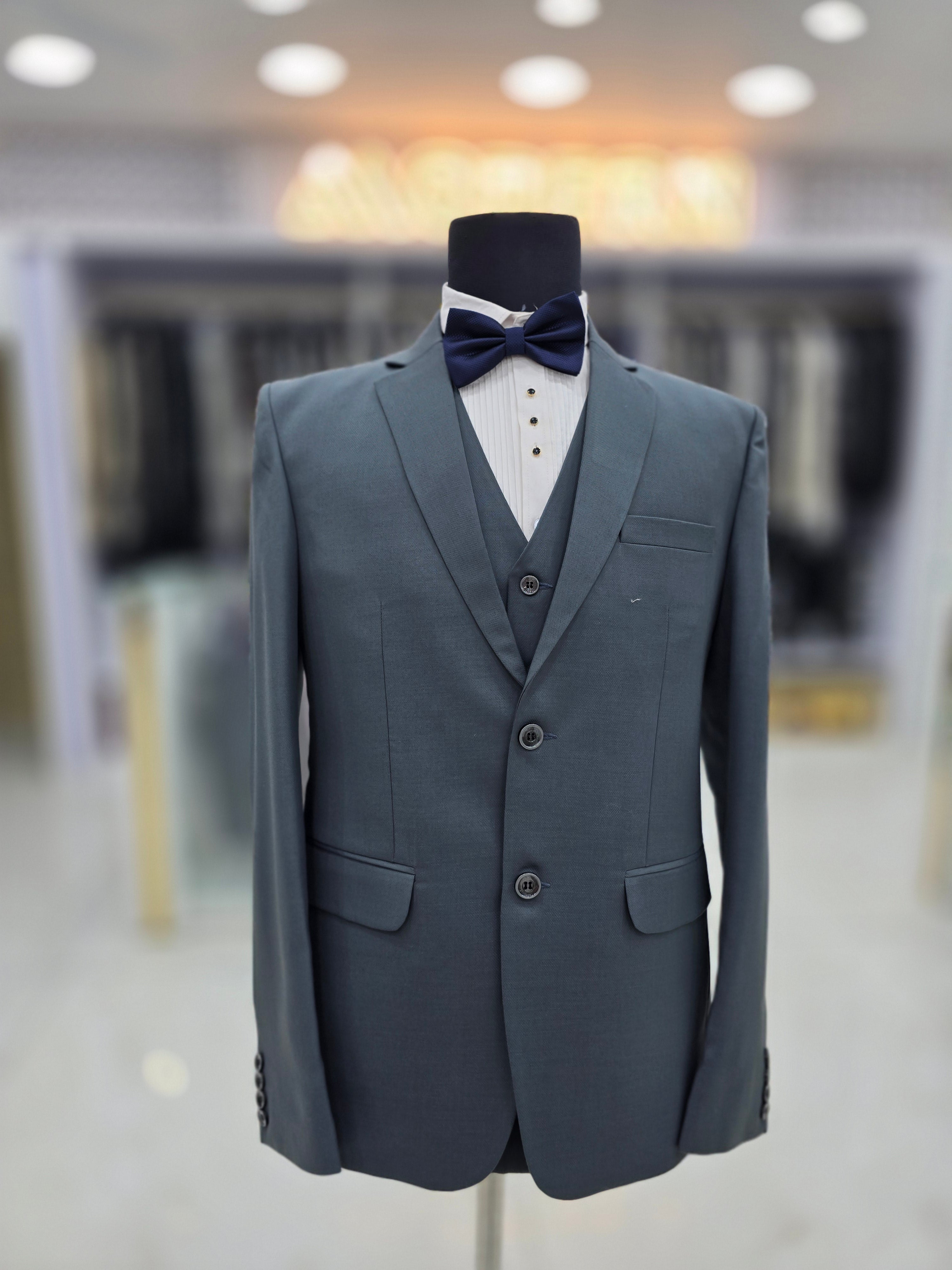 Sage green coloured self design formal suit 3 piece with pants blazer and waistcoat