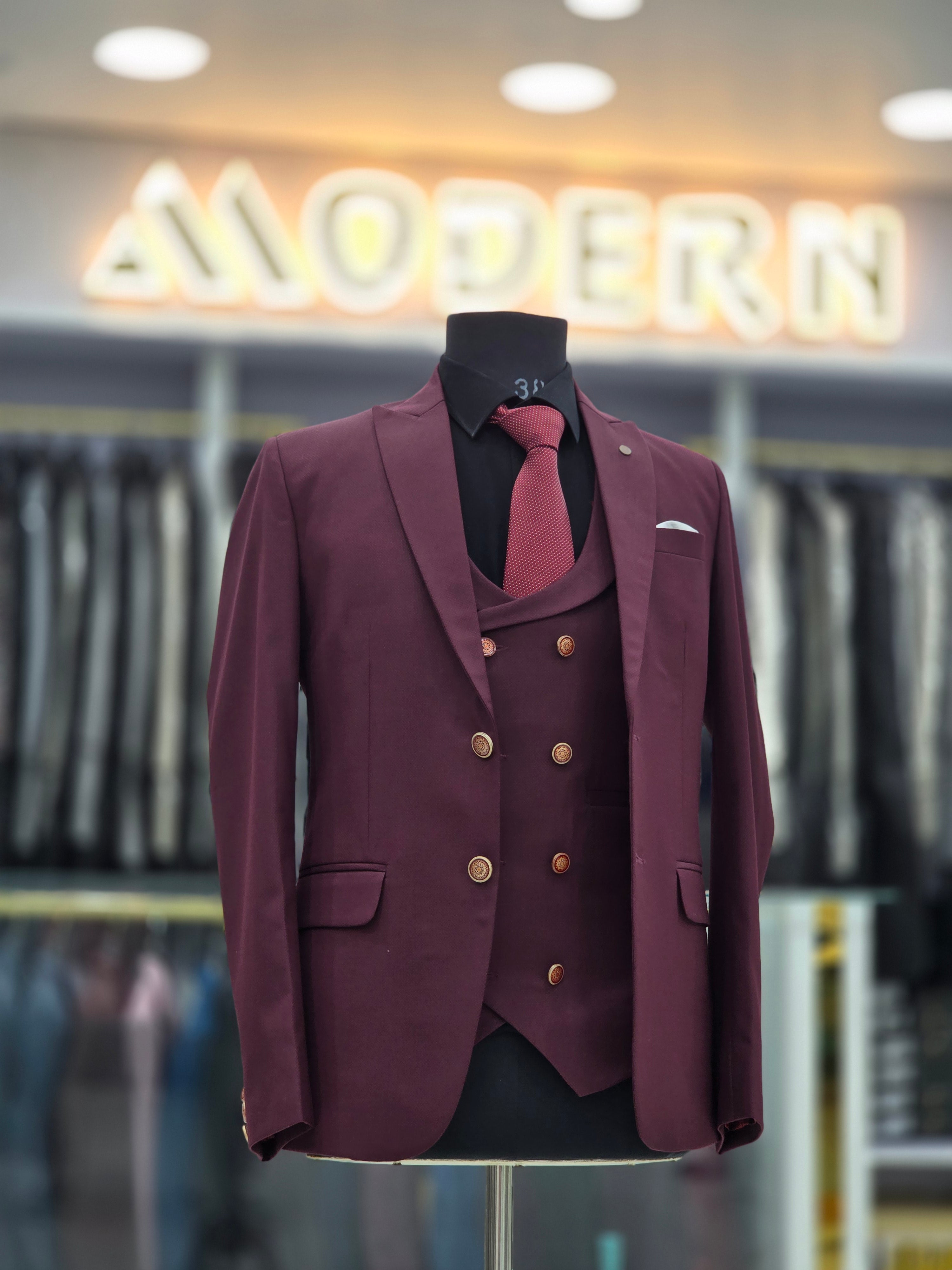 Wine coloured three piece suit with blazer double breast waistcoat and pants