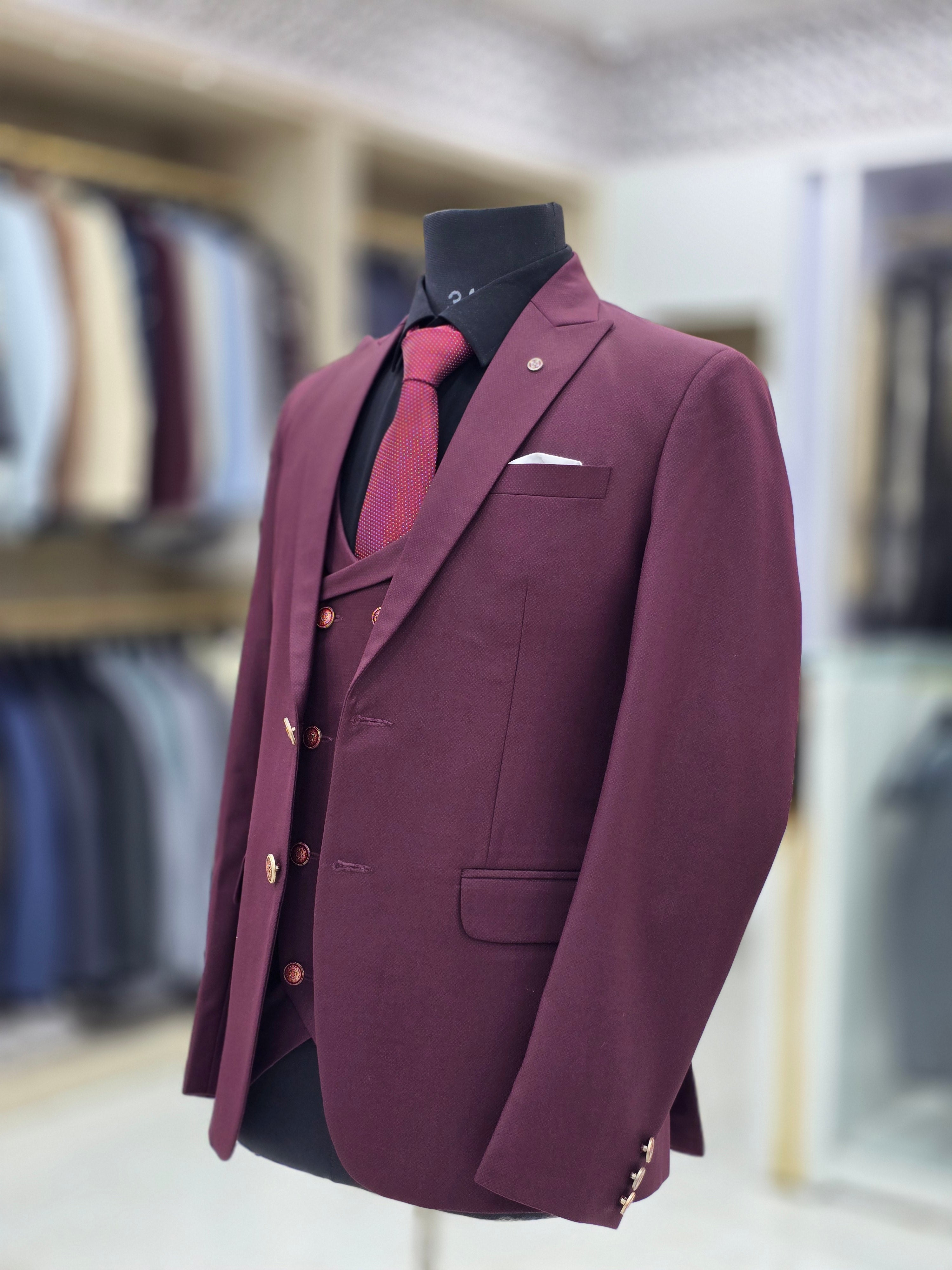 Wine coloured three piece suit with blazer double breast waistcoat and pants