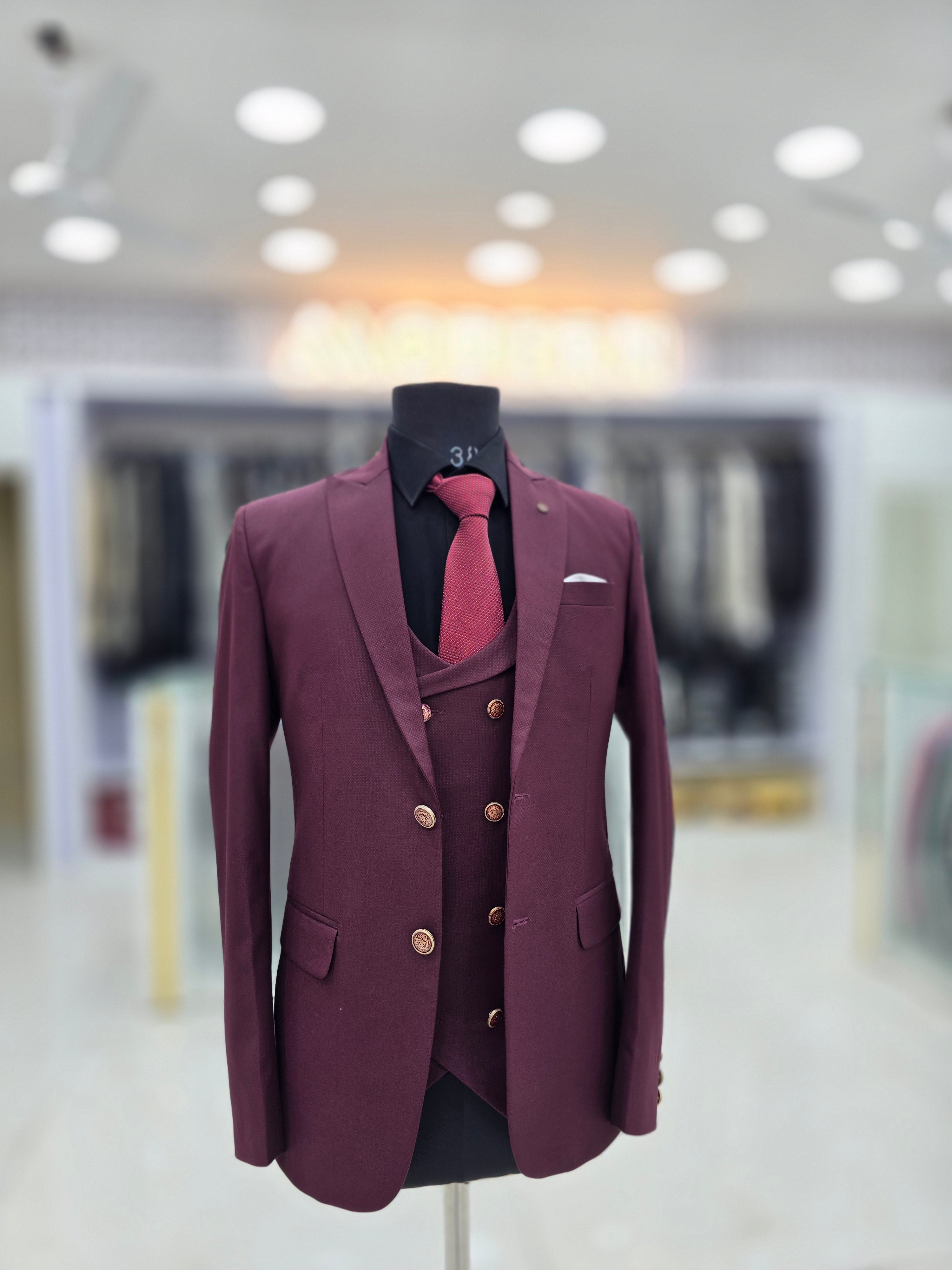 Wine coloured three piece suit with blazer double breast waistcoat and pants