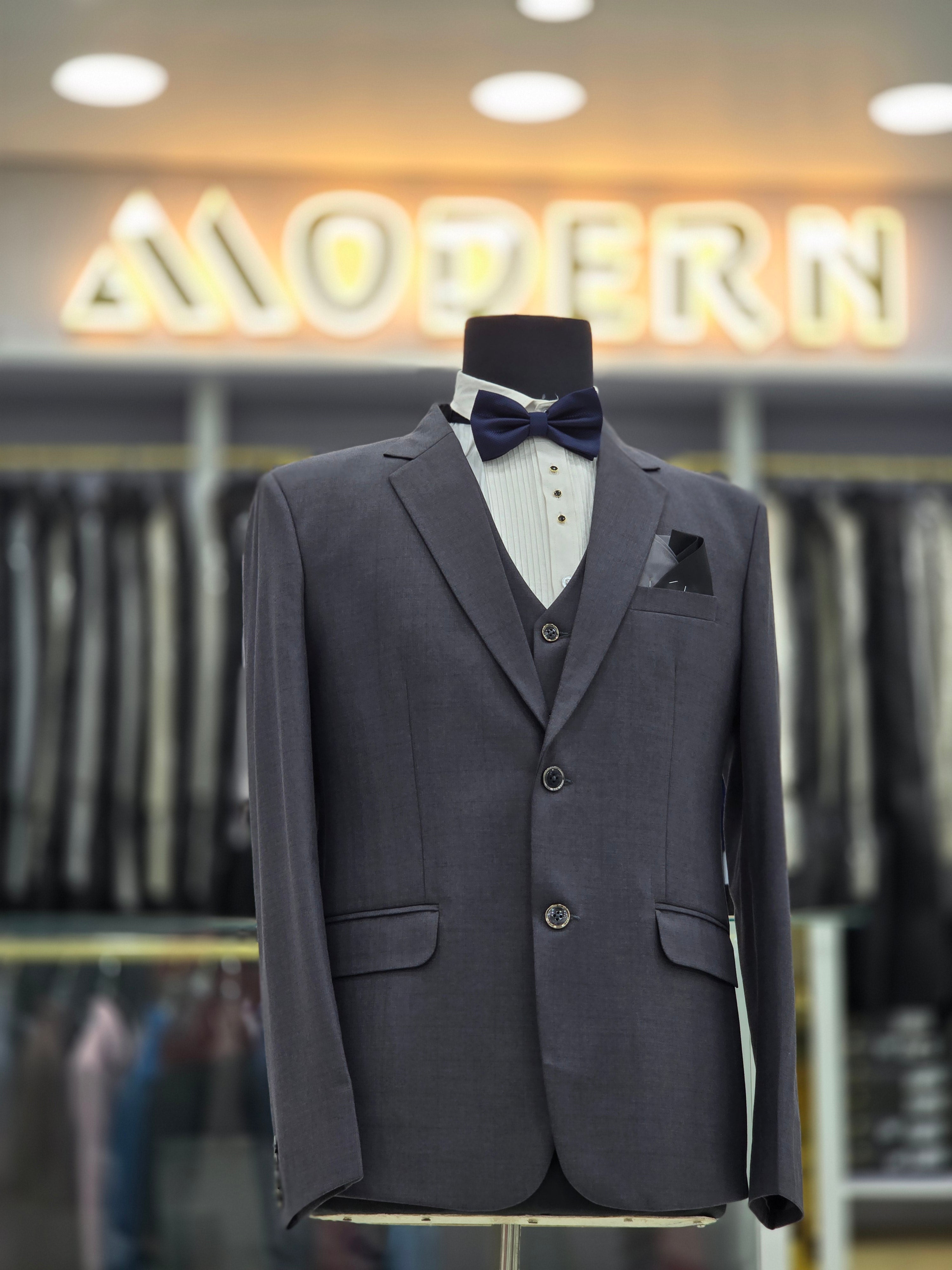 English grey coloured self design formal suit 3 piece with blazer pants and waistcoat