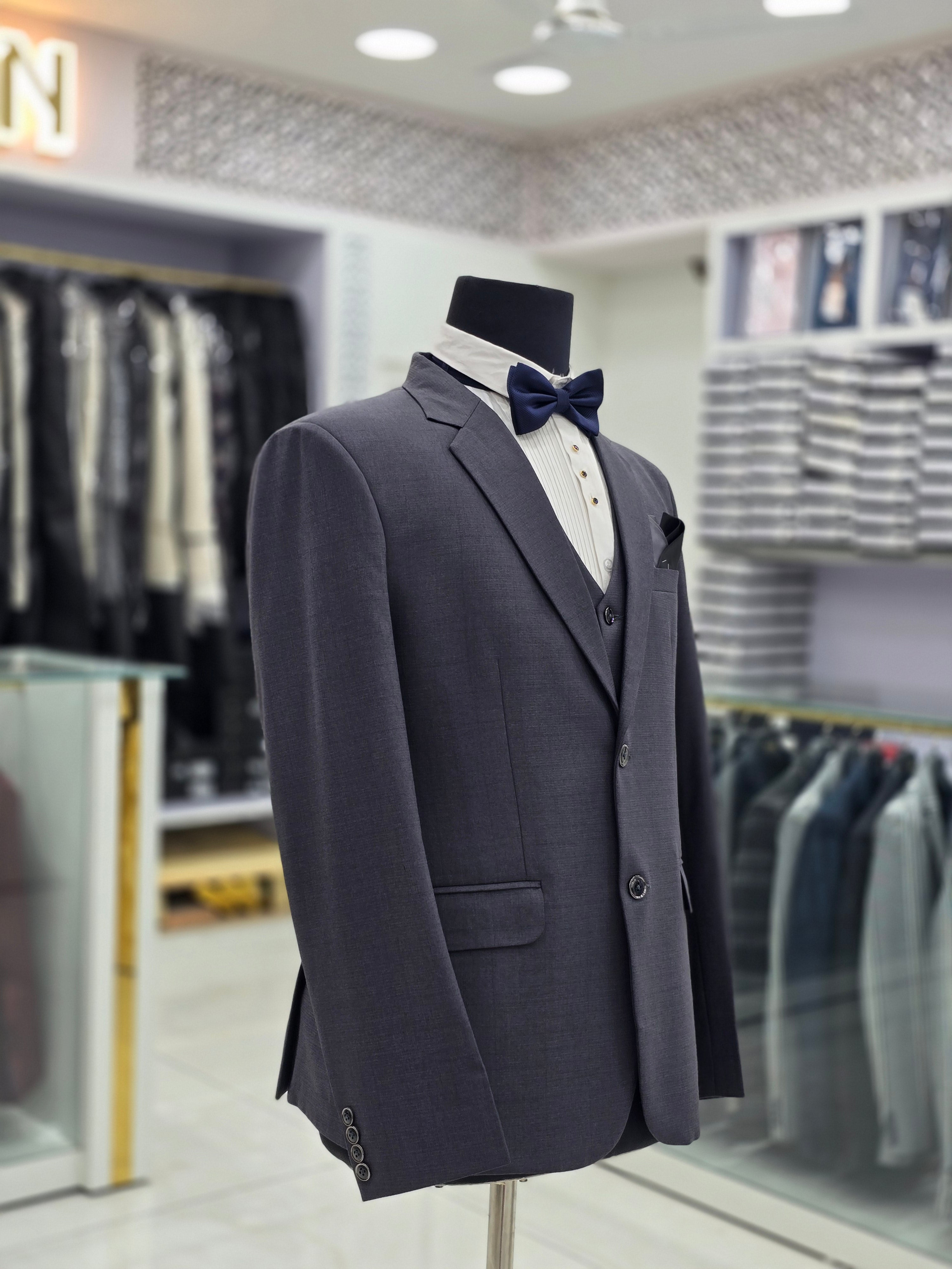 English grey coloured self design formal suit 3 piece with blazer pants and waistcoat