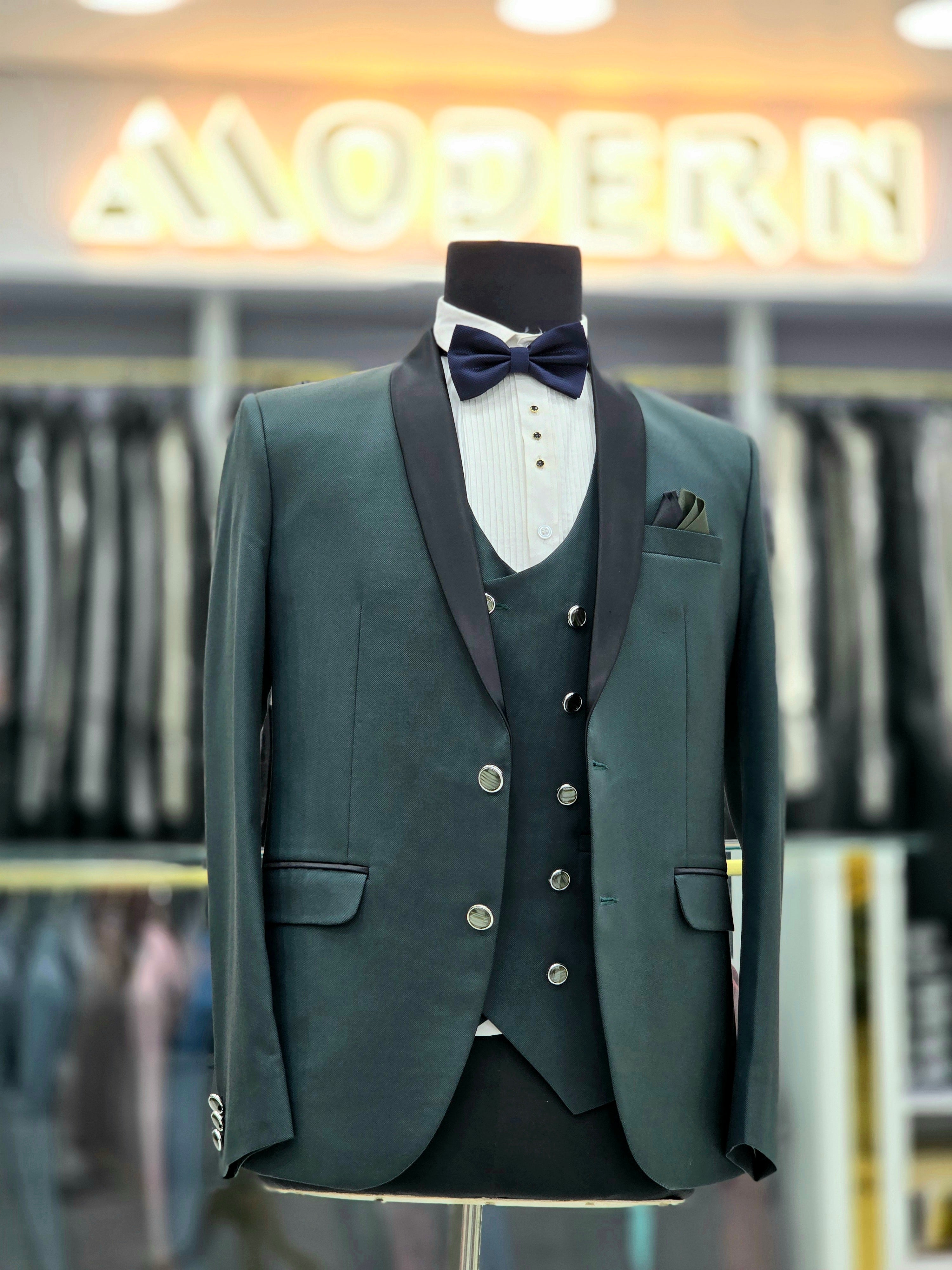 Bottle green coloured formal tuxedo three piece with pants blazer and double breast waistcoat