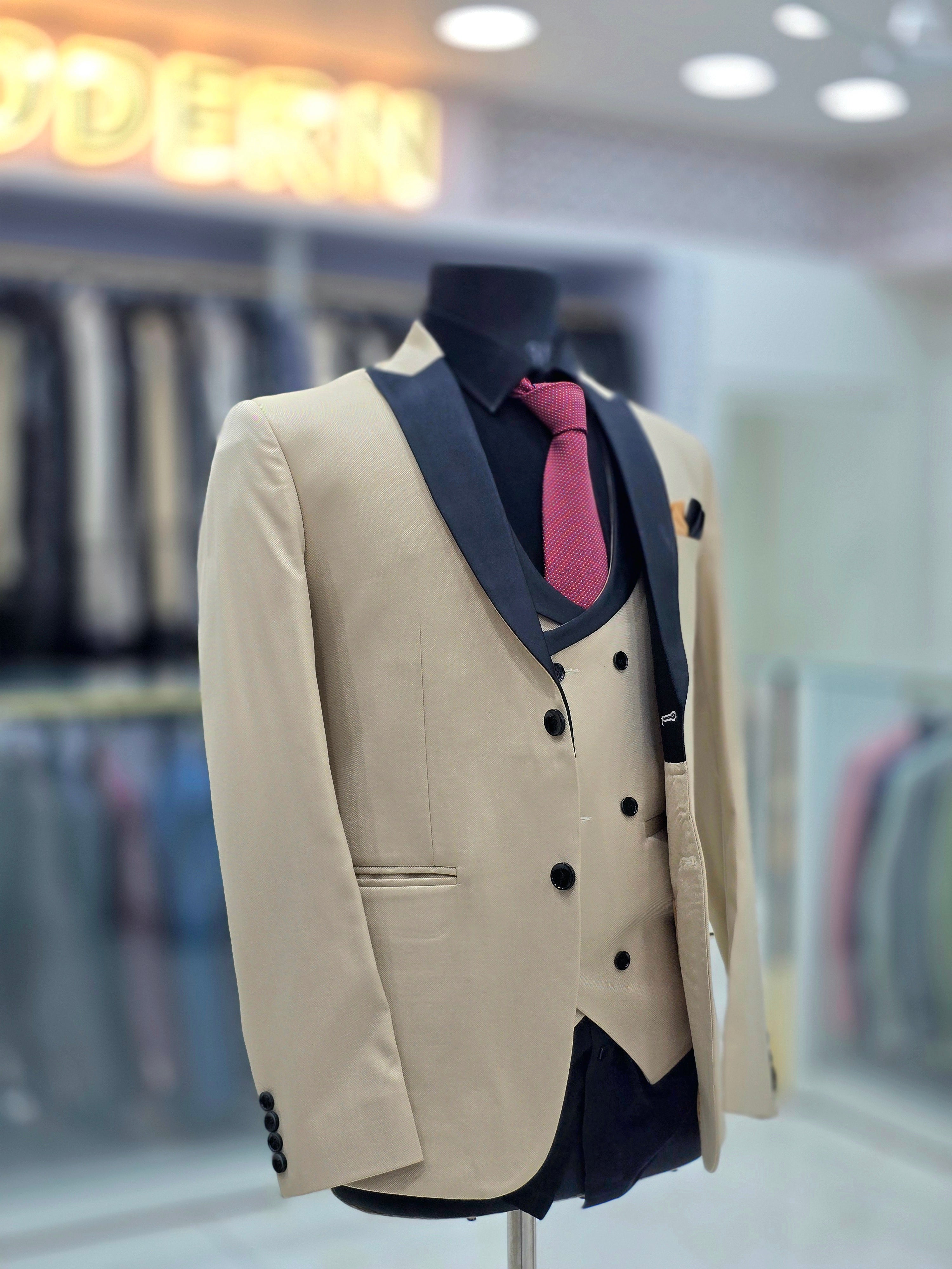 Stylish beige colored formal three piece Tuxedo with blazer pants and double breast waistcoat
