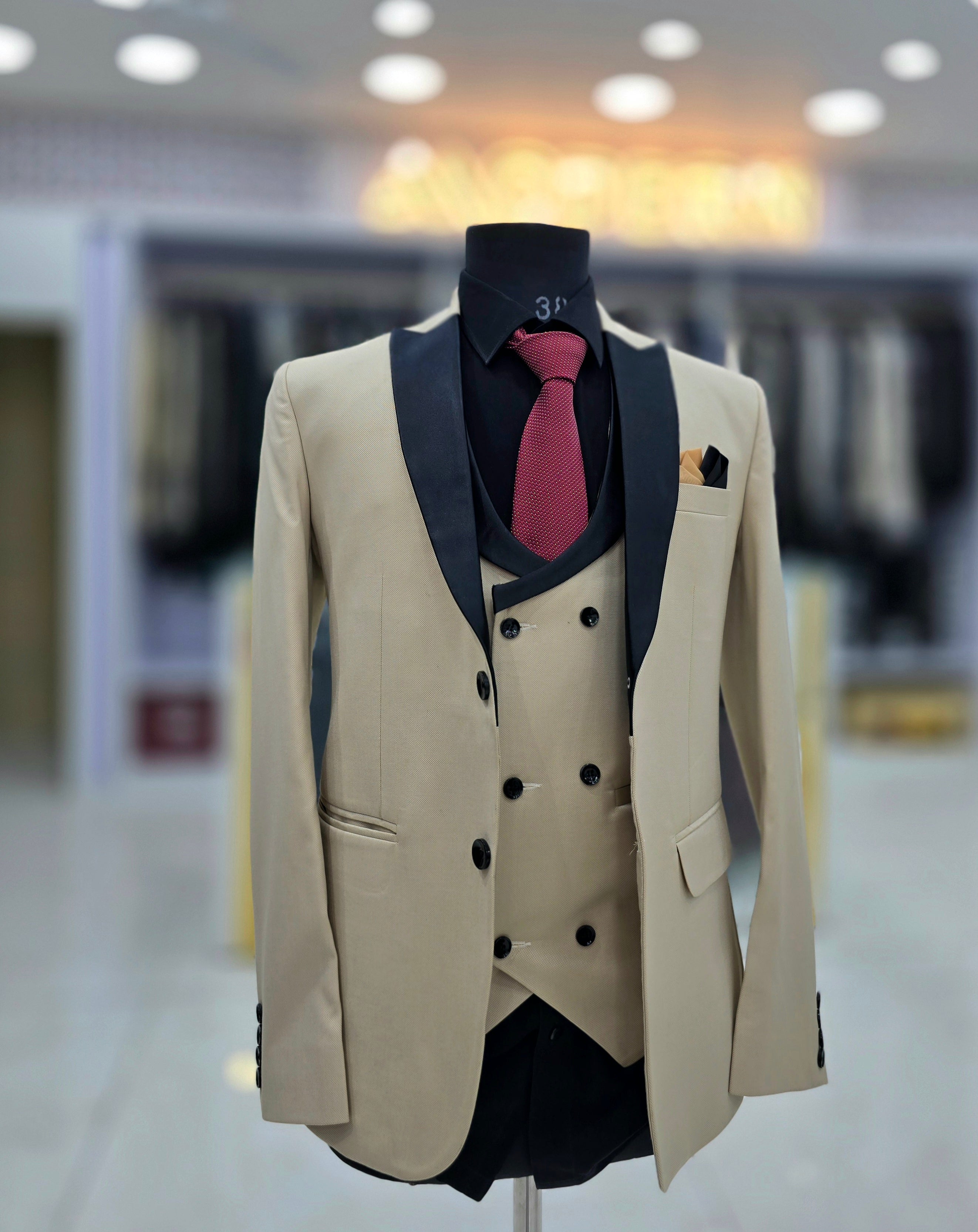 Stylish beige colored formal three piece Tuxedo with blazer pants and double breast waistcoat