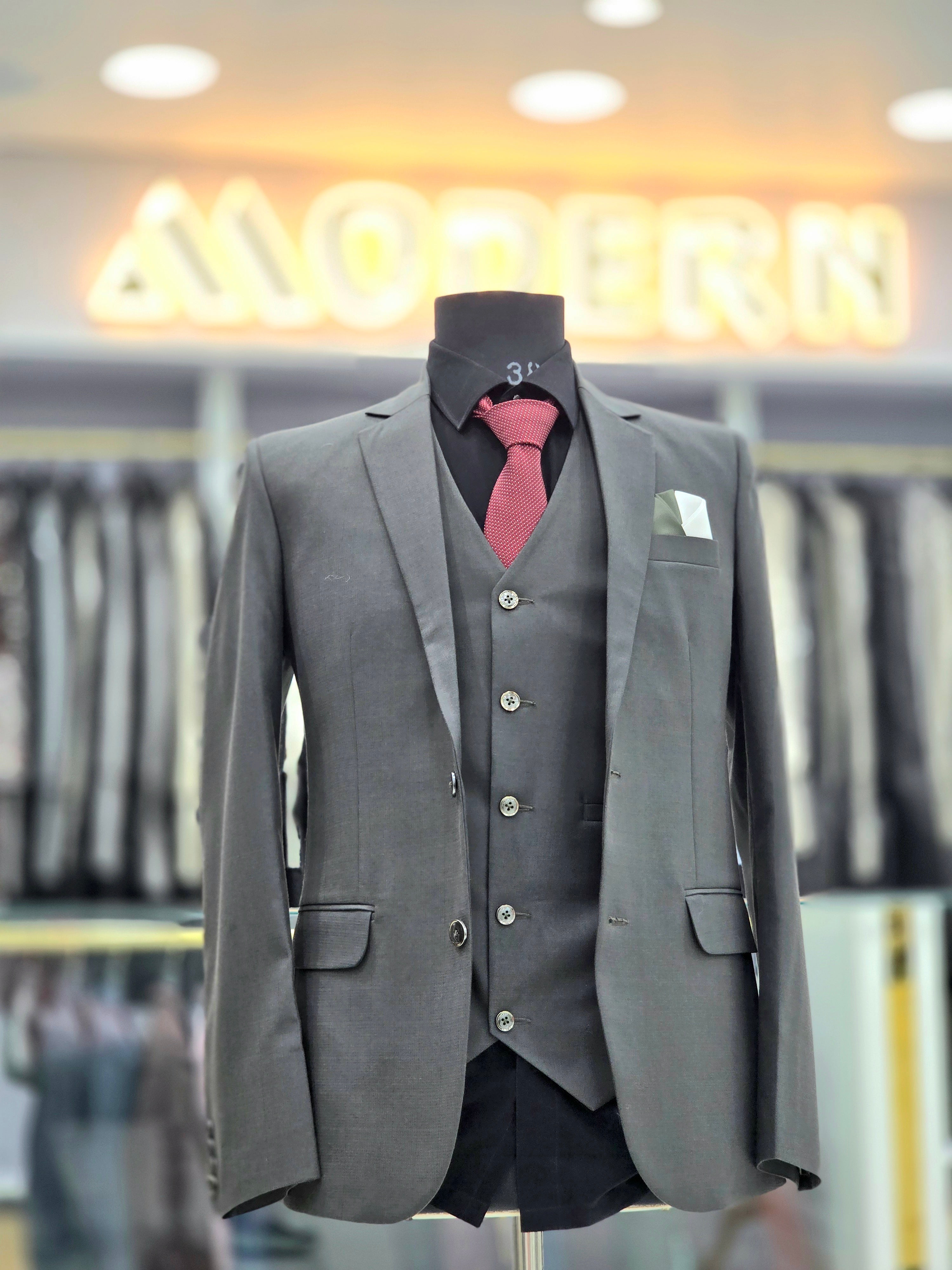 Classic grey formal three piece suit with blazer pants and waistcoat