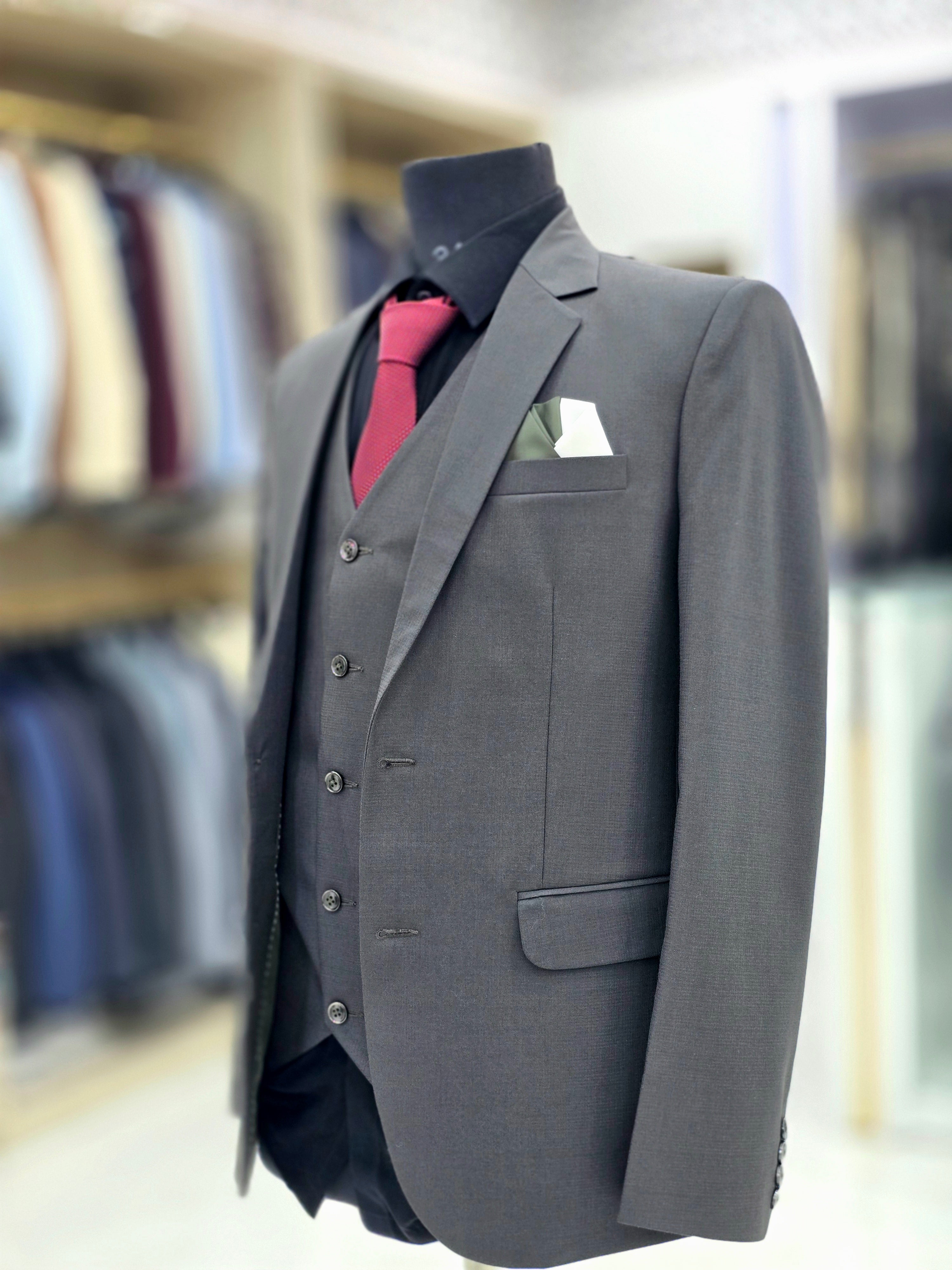 Classic grey formal three piece suit with blazer pants and waistcoat