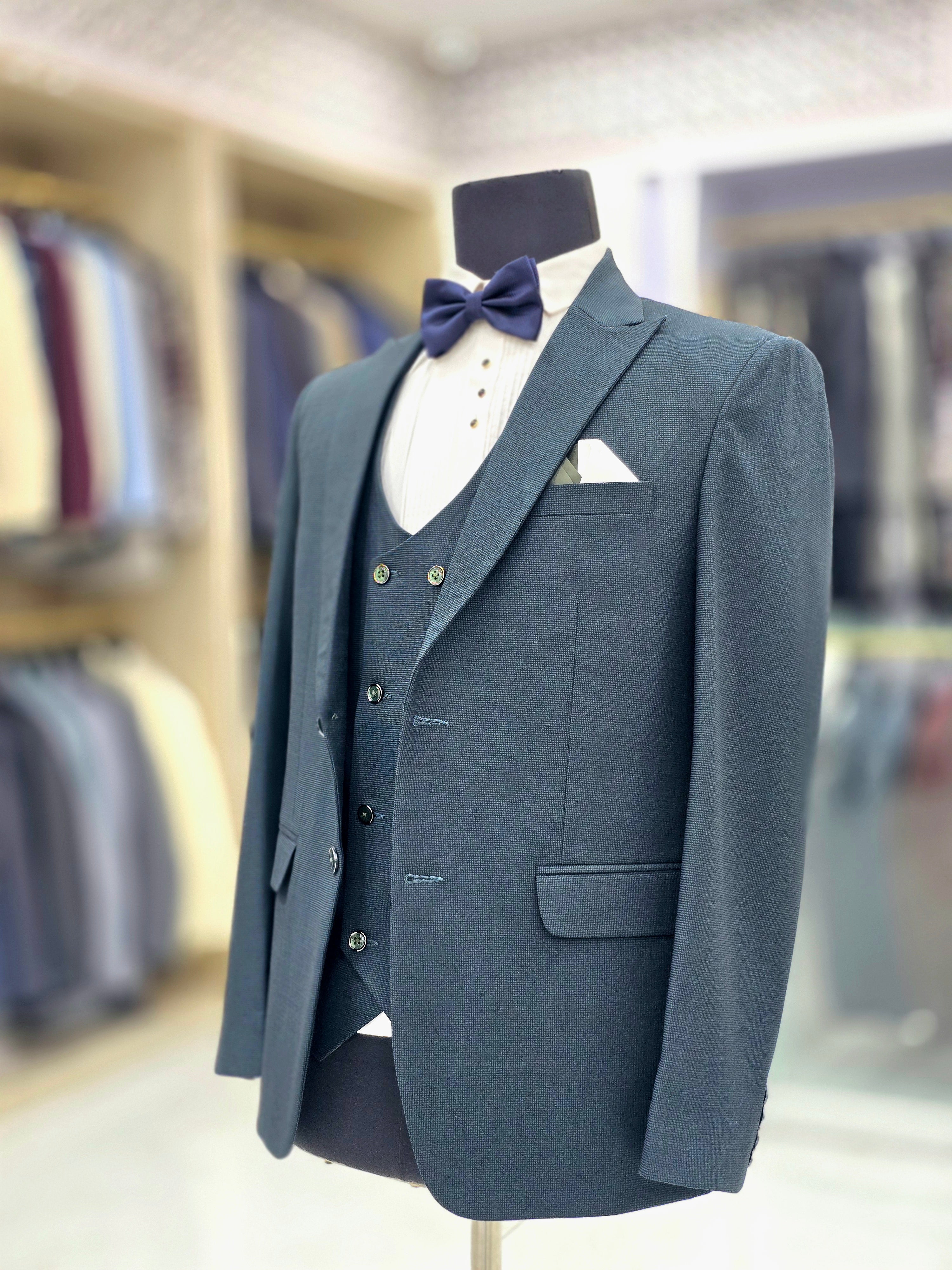 Teal green coloured self design formal three piece suit with Blazers pants and double breast waistcoat
