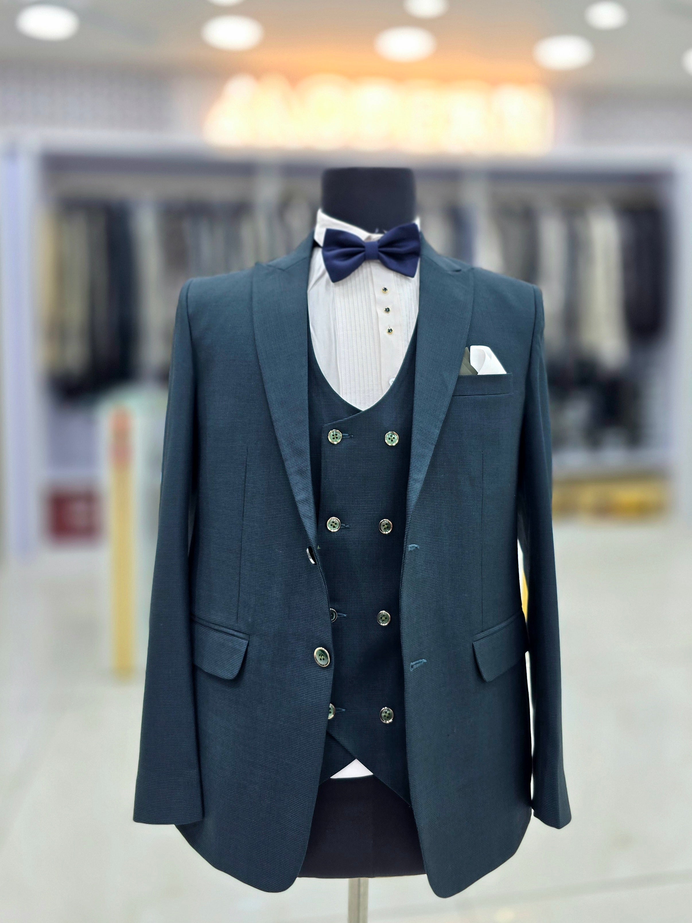 Teal green coloured self design formal three piece suit with Blazers pants and double breast waistcoat