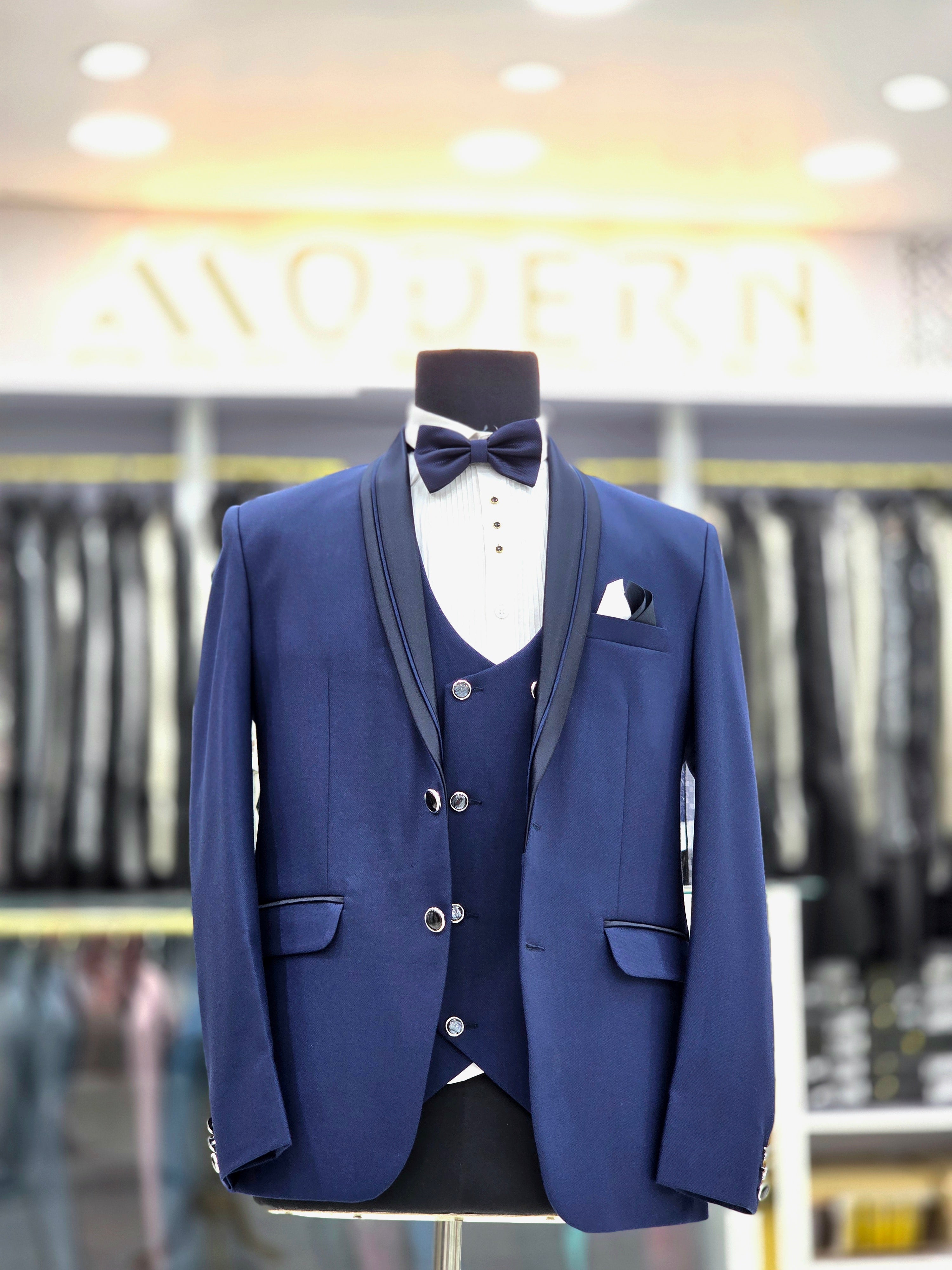 Royal blue coloured formal three piece Tuxedo with designer lapeal on blazer pants and double breast waistcoat