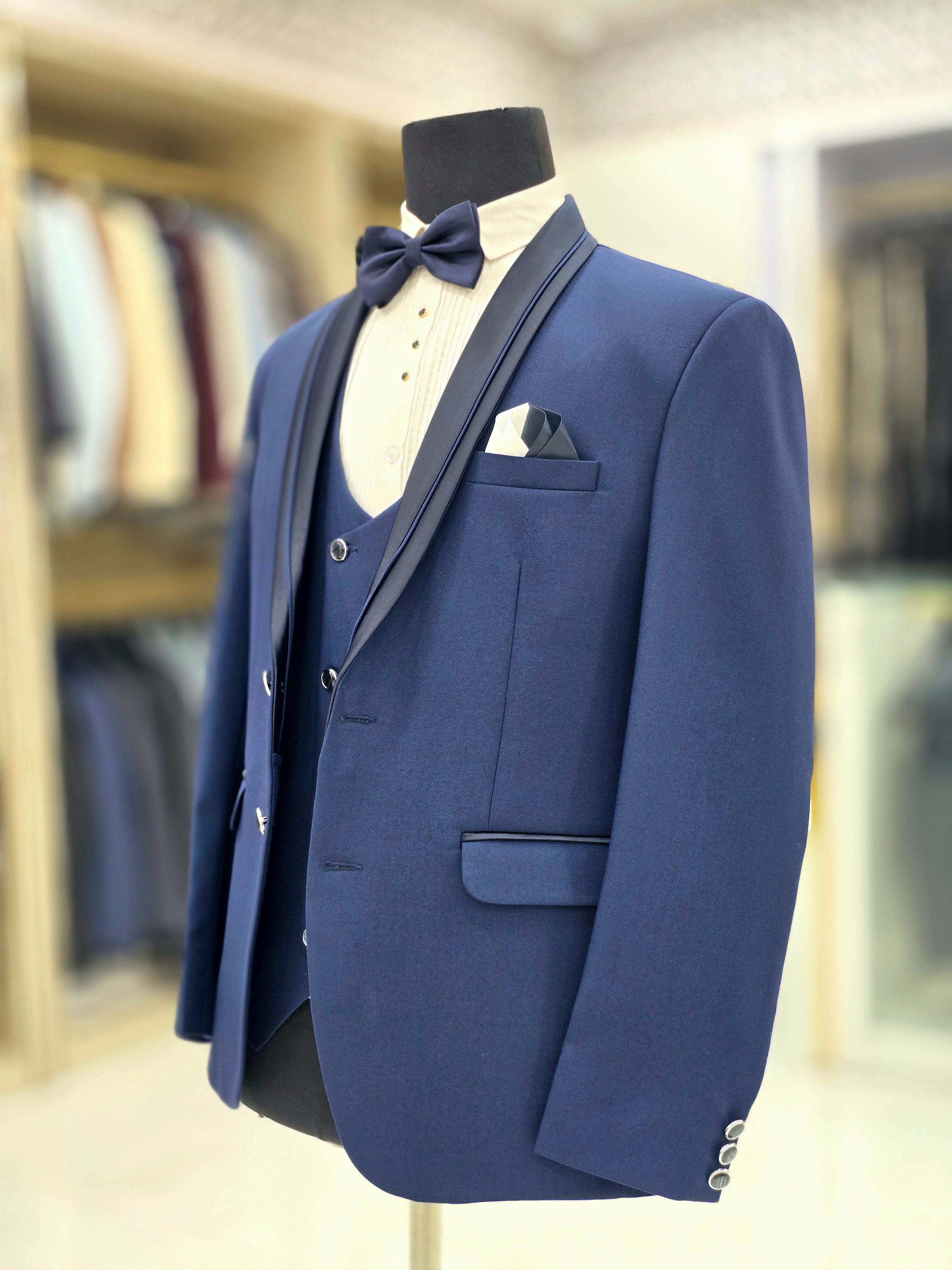Royal blue coloured formal three piece Tuxedo with designer lapeal on blazer pants and double breast waistcoat
