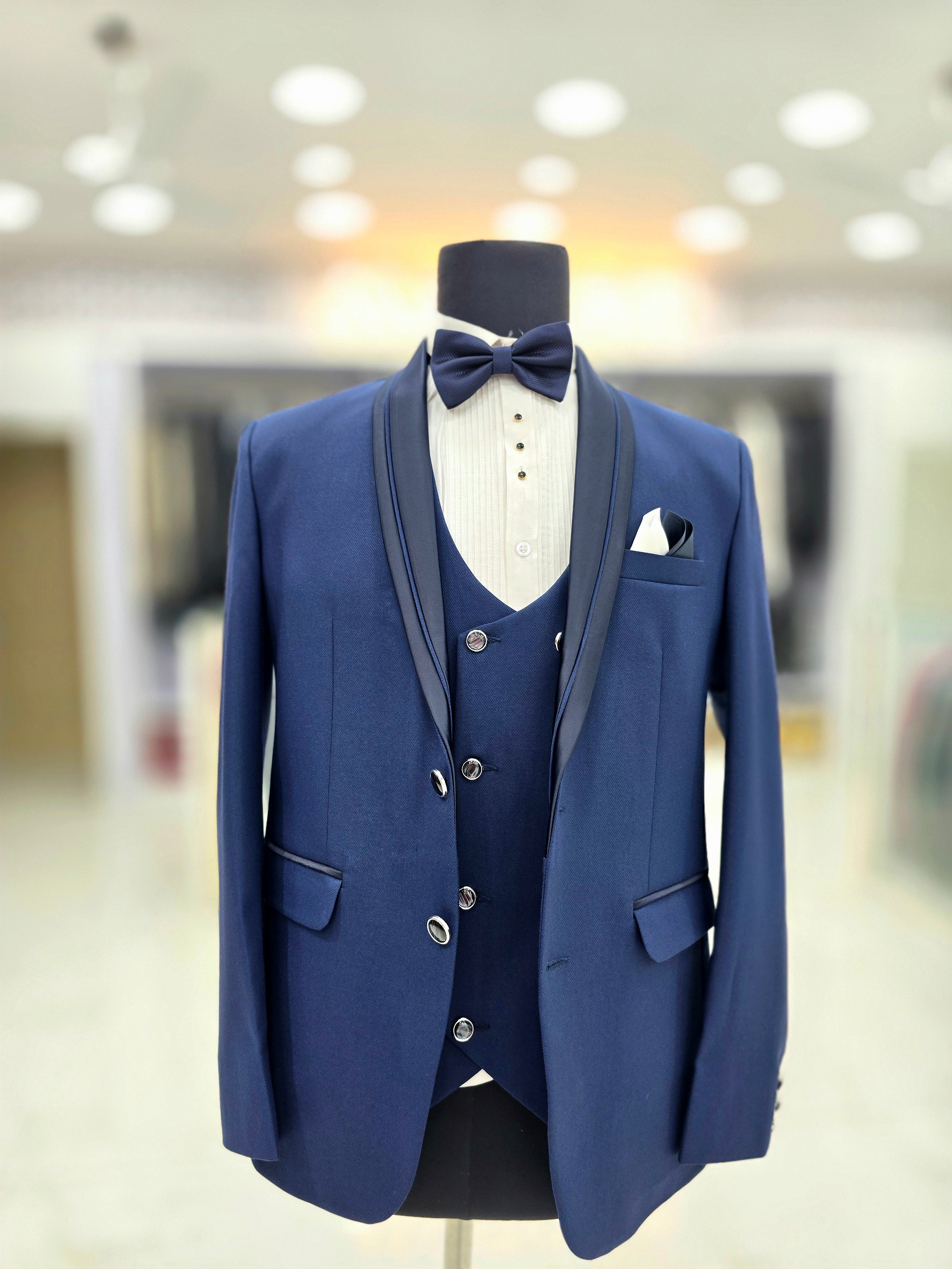 Royal blue coloured formal three piece Tuxedo with designer lapeal on blazer pants and double breast waistcoat