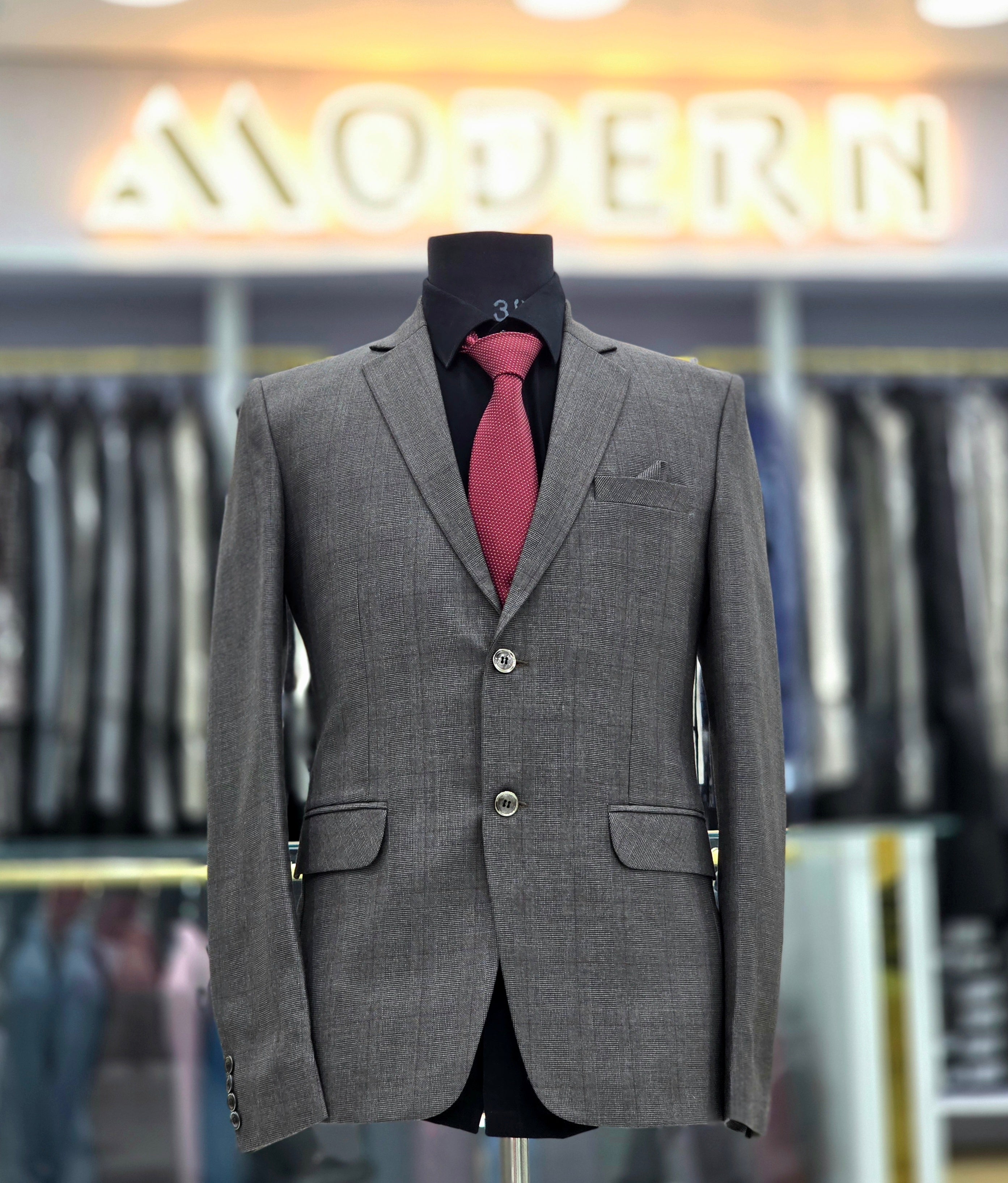 Classic charcoal greyish brown coloured formal two piece suit with pants and blazer