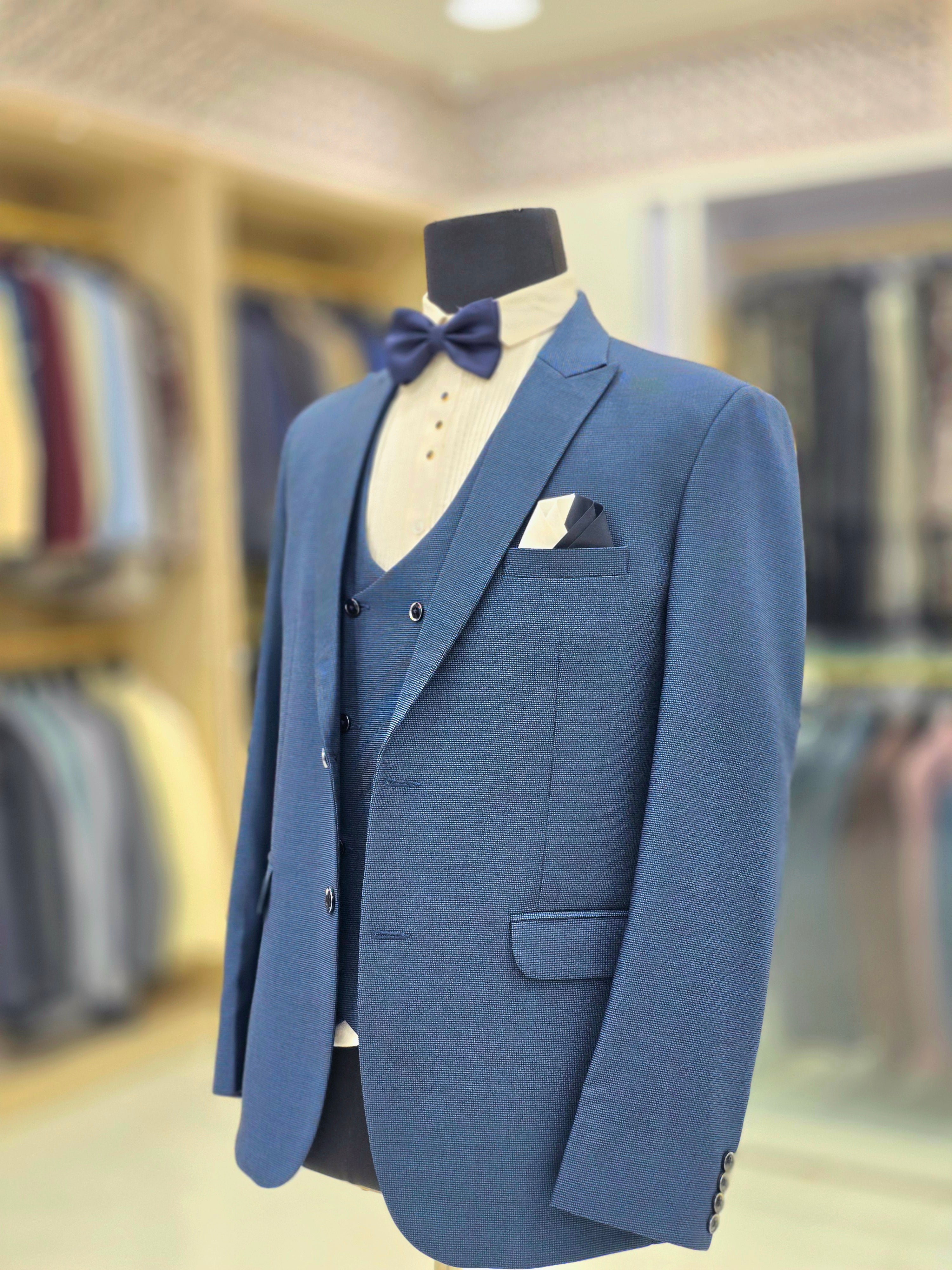 Classic english blue formal three piece suit with blazer pants and waistcoat