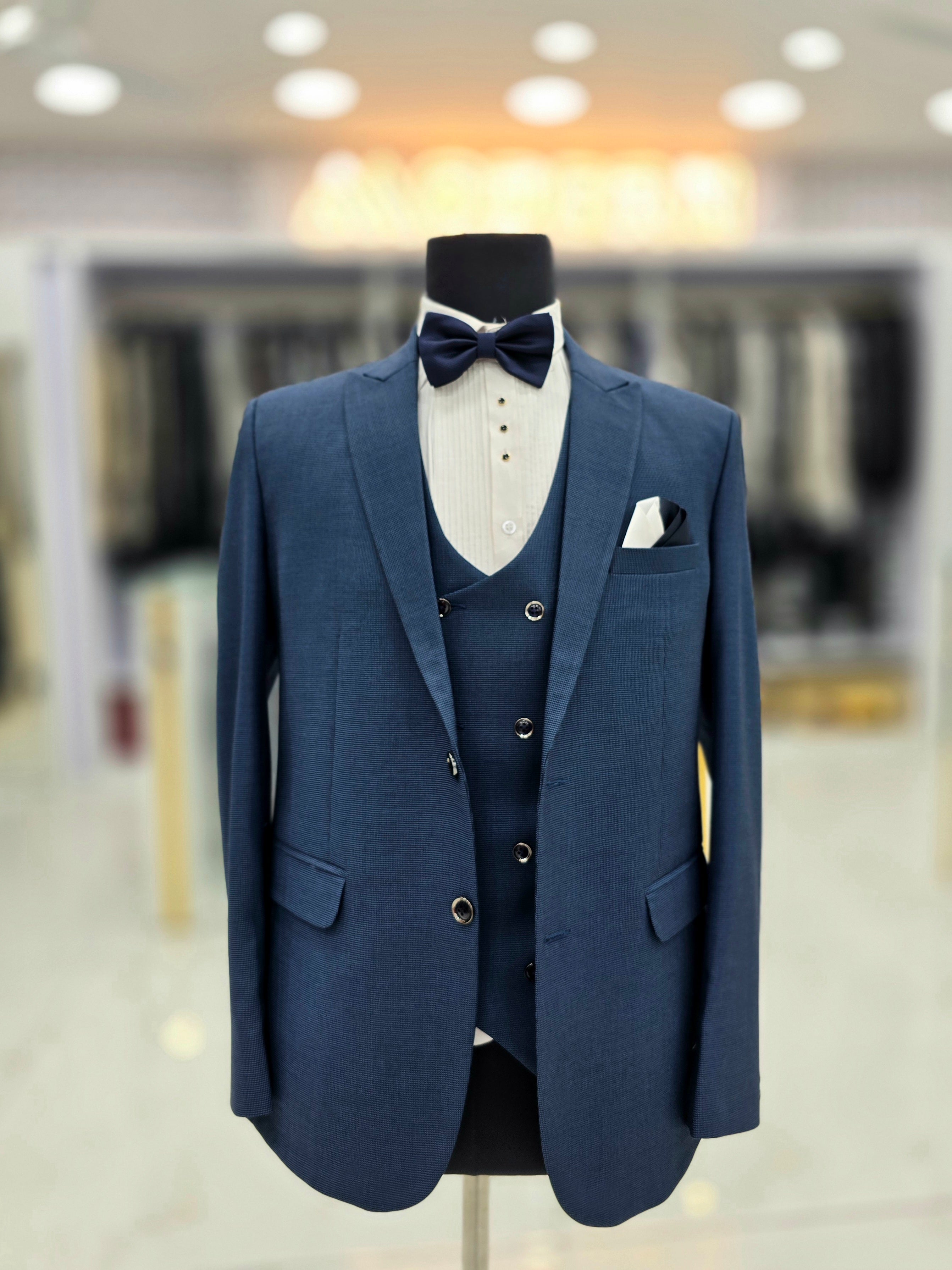 Classic english blue formal three piece suit with blazer pants and waistcoat