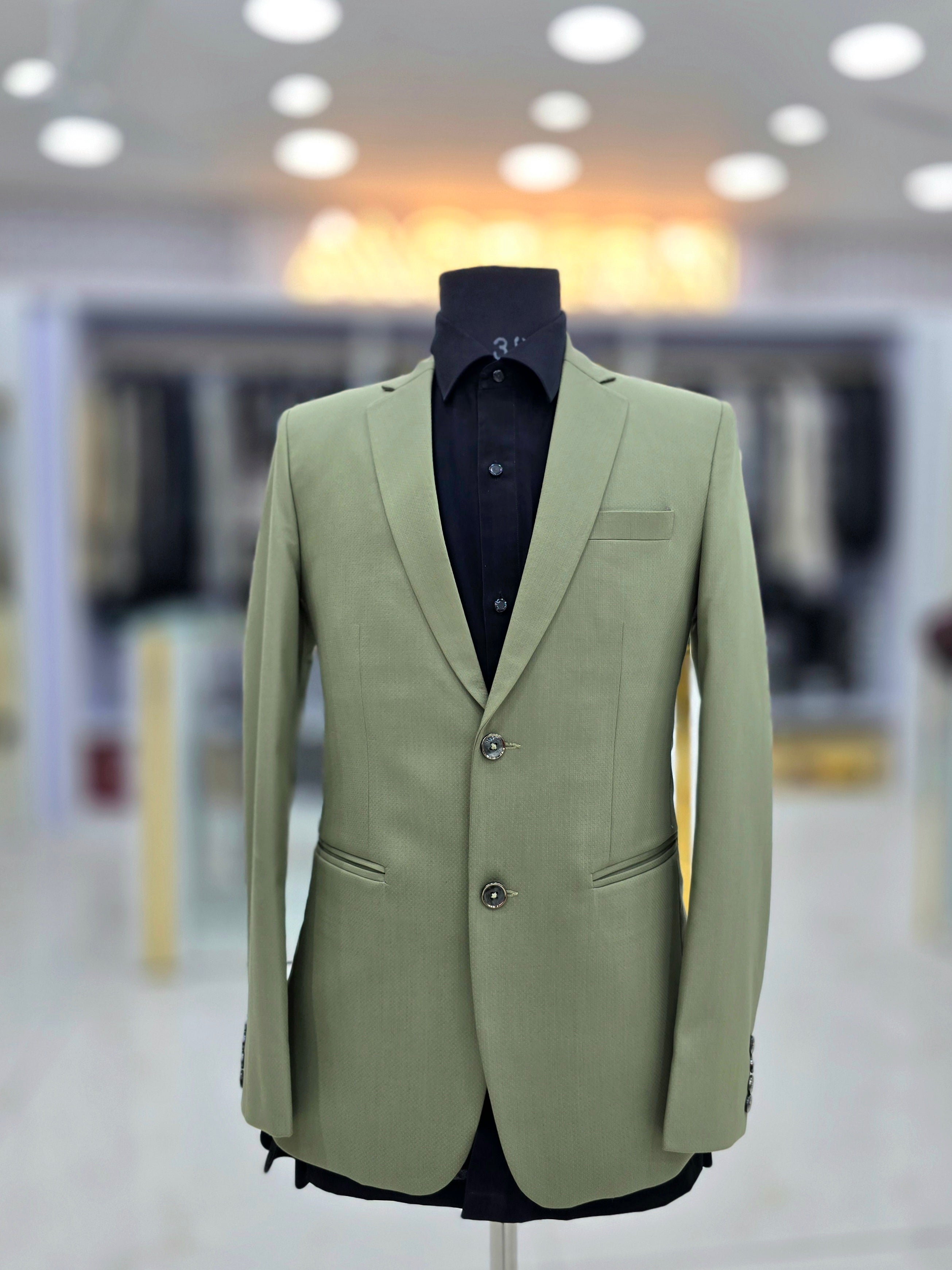 Classic green formal two piece suit with pants and blazer